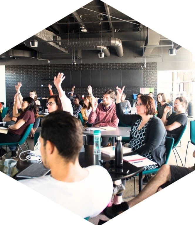 Program participants in Footscray with their hands raised