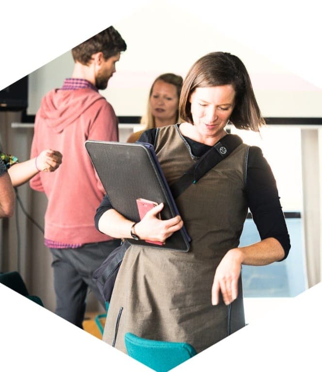 A business owner heading off with her laptop
