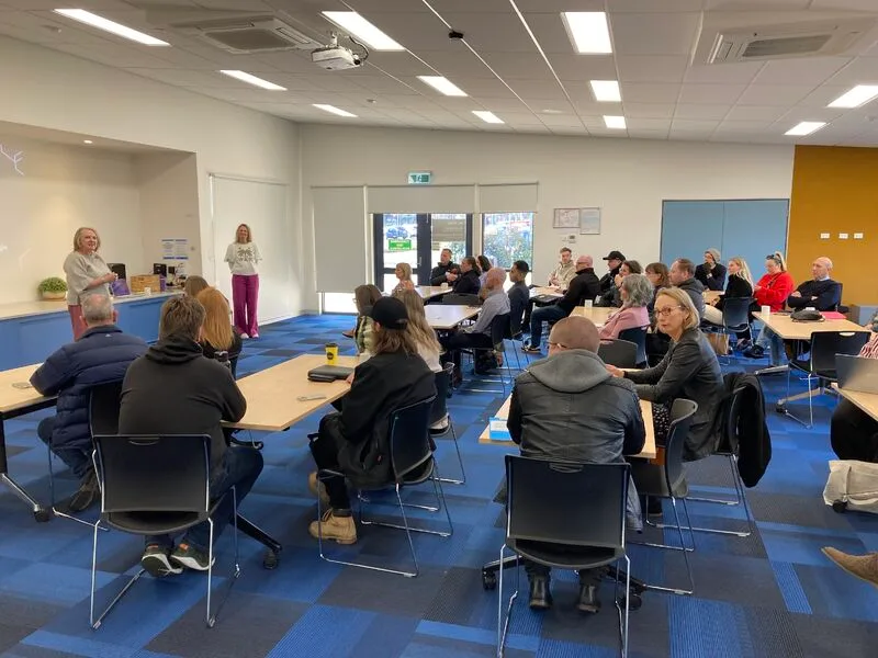 A 25eight program cohort together at an in-person workshop